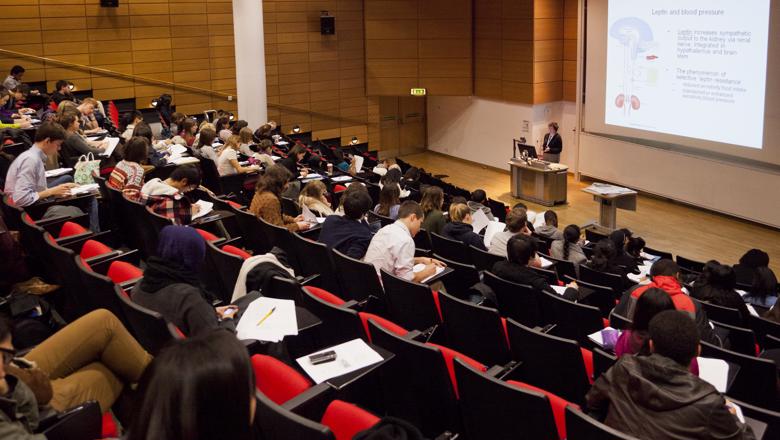 Photograph of the lecture theatre at King's College London Strand Campus during a live teaching session.